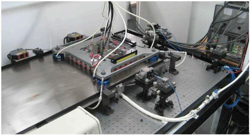 Photograph of the air-bearing planar stage using linear induction motors