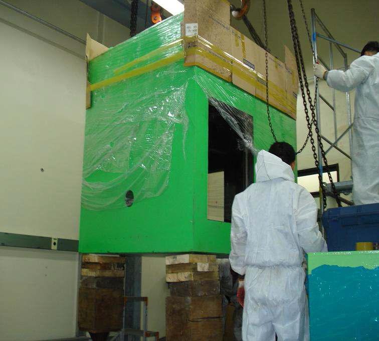 Lifting of shielded glove box by inserting wood support.