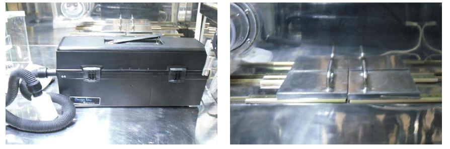 Vacuum cleaner (left) and Steel box for sample and waste storage (right) installed in shielded glove box.