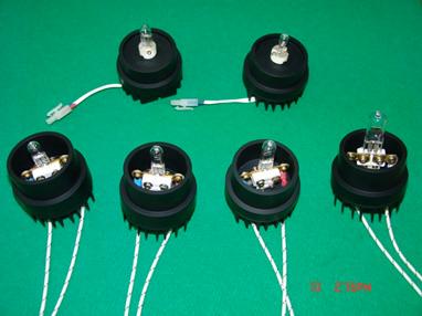 Lamps with different powers placed on their sockets.