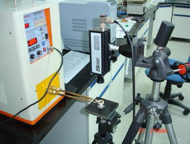 The experiment set-up in this study for induction heating. A sample was placed of a magnetic coil. The temperature/time profile of the sample was inspected by an infra riend t hsee ncseonrt.