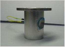 Fabricated reflective mirror mounted optical fiber accelerometer.