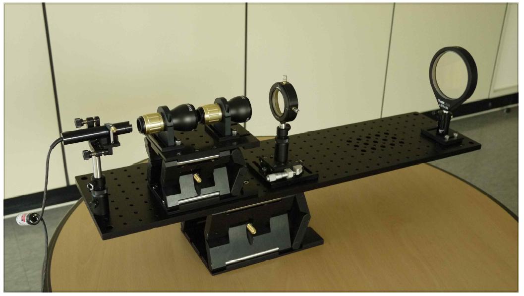 송신광학계의 레이저 빔 발산 조절을 위한 시험광학계 구성.