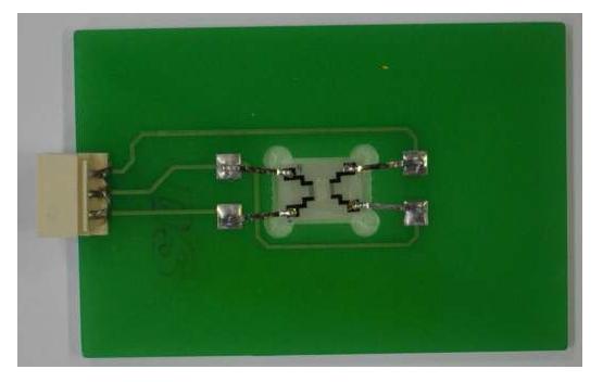 Photo of SAW sensor mounted on PCB.