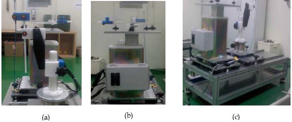 Fig. 11. Calibration stage consists of (a) chamber holder, (b) phantom base, and (c) body.