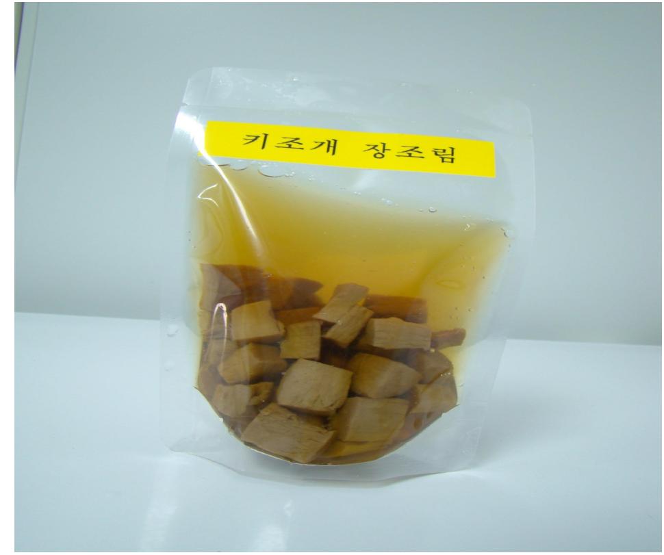 Image photo of pen-shell jangjorim sample packed in retortable pouch for the use of both ambient and refrigerated storage.