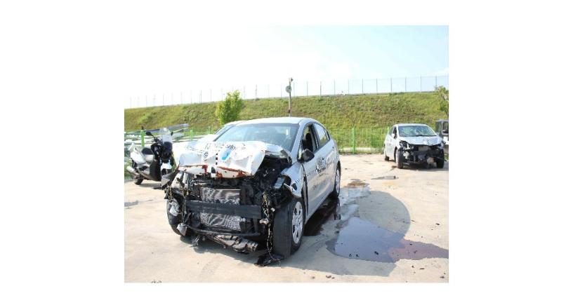 The post-test vehicle with frontal barrier impact