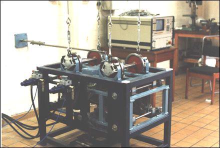 Reduction of vertical wheel-rail force using tension wires on the MMU 1/5 scale roller rig