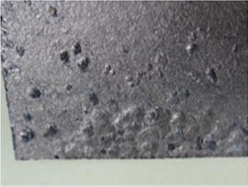 Dimples on the surface of the expanded graphite coating.