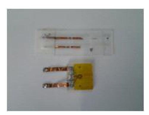 Photograph of RF coils, solenoid type(top) and spiral type (bottom) developed in the study.