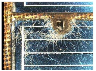 Impact hole at retrieved HST solar panel