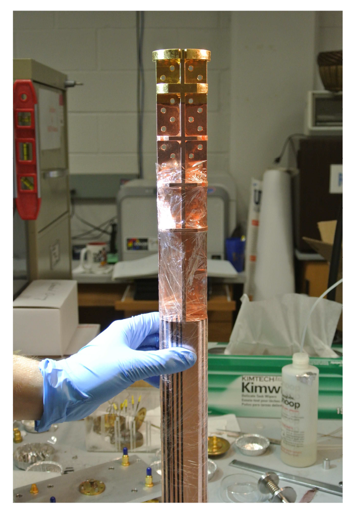 Fabricated copper nuclear demagnetization stage (CNDS) with wrapping to protect from corrosion