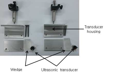 Components of housing in ultrasonic transducer fixing zig