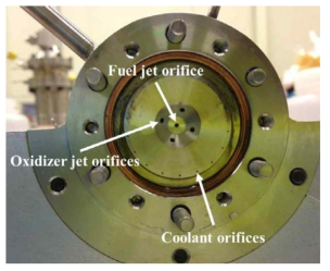 Pentad impinging jets injector of the engineering model of 500 N scale hypergolic thruster.