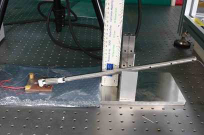 Photo shows a impact hammer with a ruler for measurement of impact hight or energy.