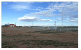 The landscape of the newly built Erdene office (red wall and white windows) and the Erdene dust monitoring tower.