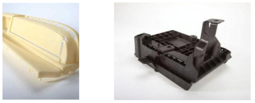 Arm-rest part of natural-color cellulose-fiber/PP compound1) & Ford battery holder of black cellulose-fiber/PP compound