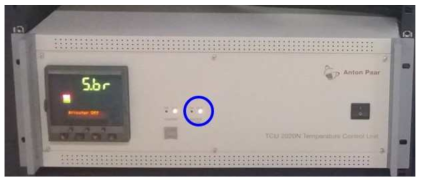 Temperature controller with green light on cooling panel, indicating normal operating of chiller