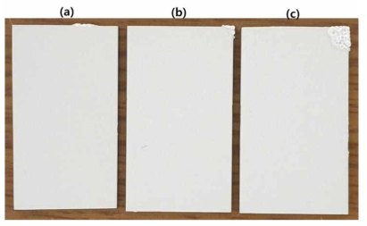 Photographs of PEO-treated AZ31 Mg alloy for (a) 180 s at 10 mA/cm2, (b) 90 s at 20 mA/cm2 and (c) 70 s at 50 mA/cm2 of DC in 0.1 M NaF + 0.2 M NaOH + 0.3 M Na2SiO3 solution