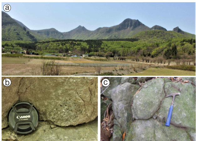 Features of Nari cladera and major outcrops. (a) Overview of the Nari caldera showing Albong lava dome (A), Nari Scoria Deposits (N), and western caldera rim, which linked by a few of peaks: Hyeongjebong (H), Mireuksan (M), Yudubong (Y) and Gitdaebong (G); (b) Trachyandesite lava capturing a vesicular scoria; (c) Polygonally jointed trachyandesite lava