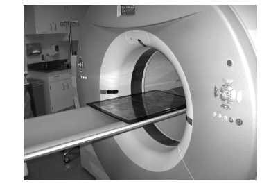 Acquiring PET/CT data of a 57Co flood source. The flood source is placed with its long axis parallel to the scanner axis and centered in the field of view